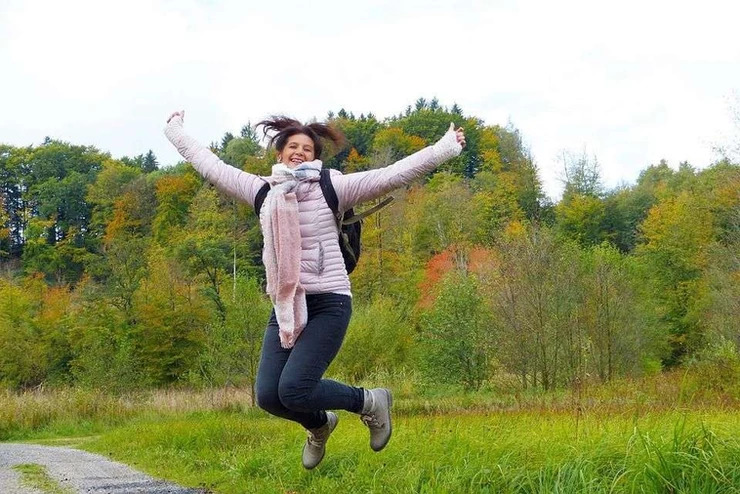 Happy woman jumping in the air